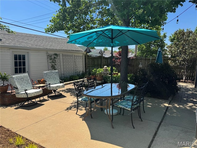 6060 Oleatha Ave, Saint Louis, MO 63139 - view of patio / terrace featuring fence and outdoor dining area