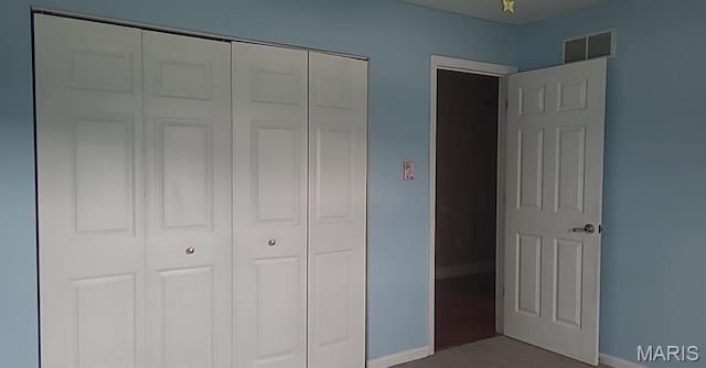 701 Deerfield Ct, Union, MO 63084 - unfurnished bedroom with a closet, baseboards, and carpet flooring