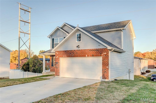 traditional home featuring driveway, brick siding, a front yard, and a garage