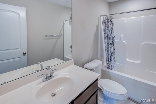 bathroom featuring toilet, vanity, and shower / tub combo with curtain