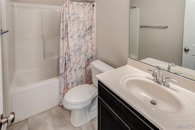 bathroom featuring toilet, tile patterned floors, vanity, and shower / bath combo