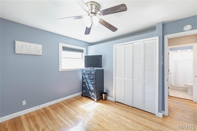 890 Tyson Dr, Florissant, MO 63031 - unfurnished bedroom with hardwood / wood-style floors, a closet, and baseboards