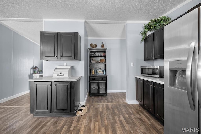 29 Pine Ln, Cedar Hill, MO 63016 - bar area featuring appliances with stainless steel finishes, dark wood-style floors, a textured ceiling, ornamental molding, and baseboards
