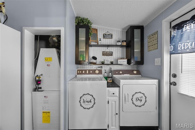 29 Pine Ln, Cedar Hill, MO 63016 - laundry room featuring independent washer and dryer, cabinet space, and a textured ceiling