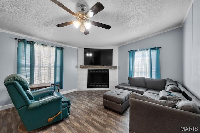 29 Pine Ln, Cedar Hill, MO 63016 - living room featuring ornamental molding, wood finished floors, a textured ceiling, a brick fireplace, and ceiling fan