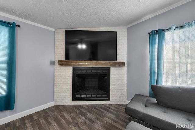 29 Pine Ln, Cedar Hill, MO 63016 - living room featuring a textured ceiling, crown molding, wood finished floors, and a fireplace