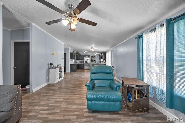 29 Pine Ln, Cedar Hill, MO 63016 - living area with lofted ceiling, a textured ceiling, ceiling fan, dark wood finished floors, and ornamental molding