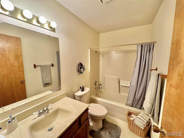 full bath with a textured ceiling, toilet, shower / bath combo with shower curtain, and vanity
