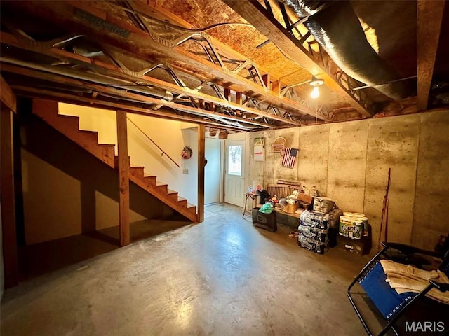 basement featuring stairs