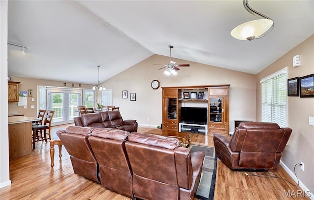 1866 Big Oak Dr, Troy, MO 63379 - living area with light wood-style flooring, ceiling fan, vaulted ceiling, and baseboards