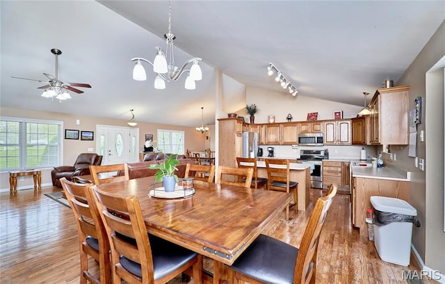 1866 Big Oak Dr, Troy, MO 63379 - dining space with vaulted ceiling, a chandelier, light wood-style flooring, ceiling fan, and baseboards