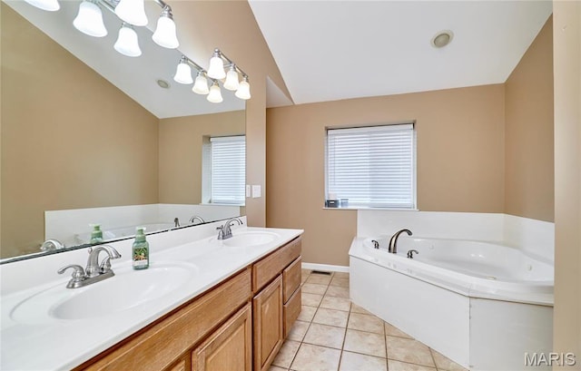 1866 Big Oak Dr, Troy, MO 63379 - full bath featuring vaulted ceiling, a bath, tile patterned flooring, double vanity, and baseboards