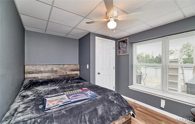 1866 Big Oak Dr, Troy, MO 63379 - bedroom featuring a drop ceiling, wood finished floors, ceiling fan, and baseboards