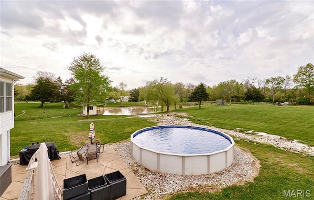 1866 Big Oak Dr, Troy, MO 63379 - view of swimming pool featuring a water view, a patio area, a yard, and a grill