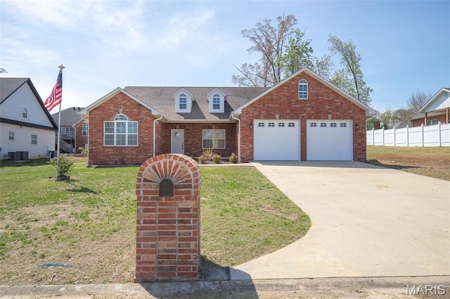 2940 Karmen Ln, Poplar Bluff, MO 63901 - view of front of home featuring a garage, brick siding, central AC, and driveway