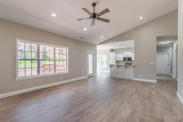 2940 Karmen Ln, Poplar Bluff, MO 63901 - unfurnished living room with a ceiling fan, light wood-style flooring, lofted ceiling, recessed lighting, and baseboards