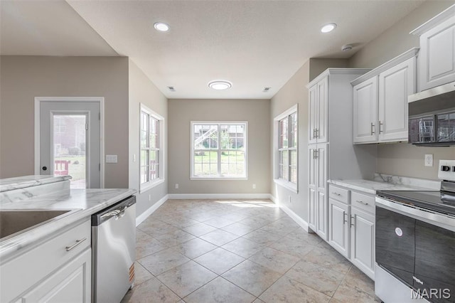2940 Karmen Ln, Poplar Bluff, MO 63901 - kitchen featuring appliances with stainless steel finishes, baseboards, white cabinets, recessed lighting, and light stone counters
