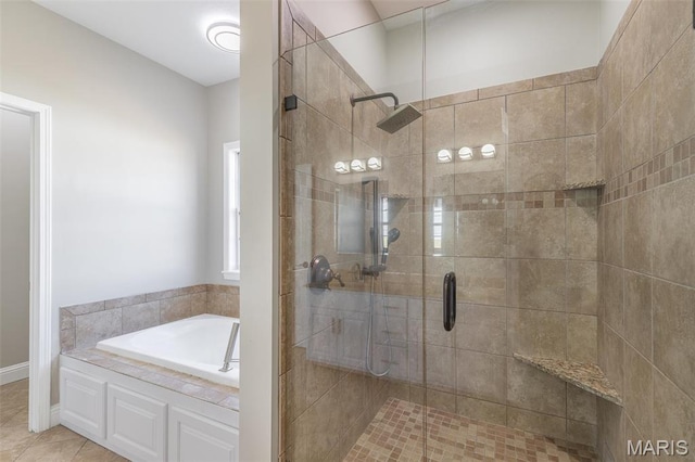 2940 Karmen Ln, Poplar Bluff, MO 63901 - full bathroom featuring a shower stall, a garden tub, and tile patterned flooring