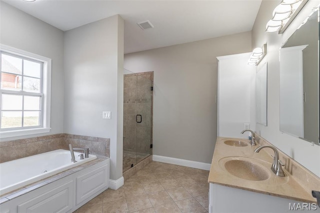 2940 Karmen Ln, Poplar Bluff, MO 63901 - full bathroom with a bath, a shower stall, tile patterned floors, baseboards, and double vanity
