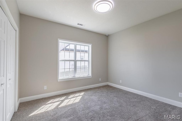 2940 Karmen Ln, Poplar Bluff, MO 63901 - unfurnished bedroom featuring carpet flooring, baseboards, and a closet