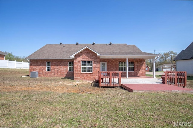 2940 Karmen Ln, Poplar Bluff, MO 63901 - back of house with brick siding, a wooden deck, a shingled roof, cooling unit, and a patio area