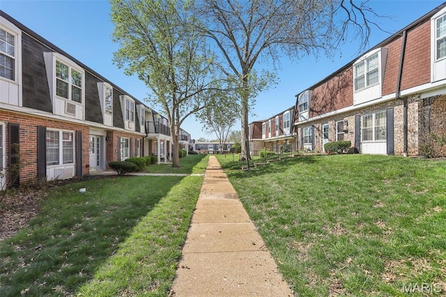 view of community with a residential view and a lawn