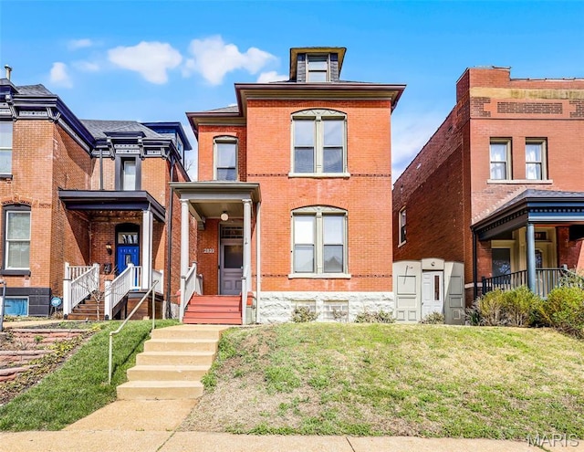 2835 Shenandoah Ave, Saint Louis, MO 63104 - view of front of property featuring brick siding and a front lawn