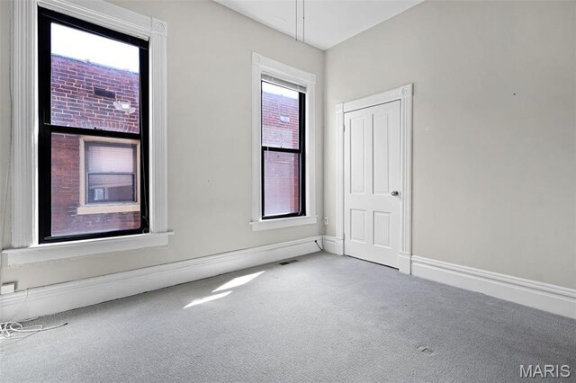 2835 Shenandoah Ave, Saint Louis, MO 63104 - carpeted spare room featuring baseboards