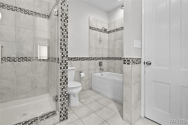 2835 Shenandoah Ave, Saint Louis, MO 63104 - bathroom featuring tile walls, toilet, tile patterned floors, a garden tub, and a shower stall