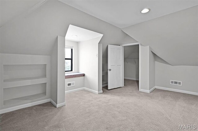 2835 Shenandoah Ave, Saint Louis, MO 63104 - additional living space featuring vaulted ceiling, baseboards, carpet flooring, and built in features