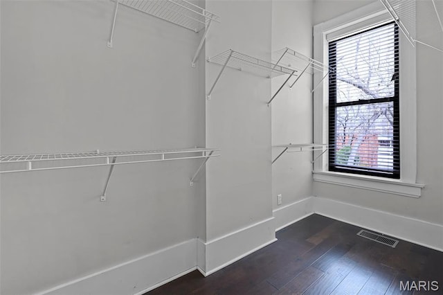 2835 Shenandoah Ave, Saint Louis, MO 63104 - spacious closet with dark wood-style flooring