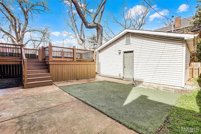 2835 Shenandoah Ave, Saint Louis, MO 63104 - view of yard featuring stairs, a wooden deck, a patio area, fence, and an outbuilding