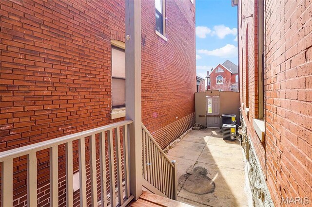 2835 Shenandoah Ave, Saint Louis, MO 63104 - view of side of home with brick siding and a patio area