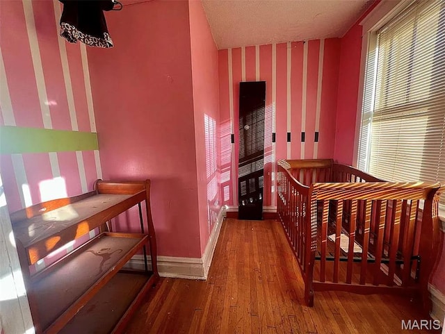 4873 Kossuth Ave, Saint Louis, MO 63115 - bedroom with wood-type flooring and baseboards