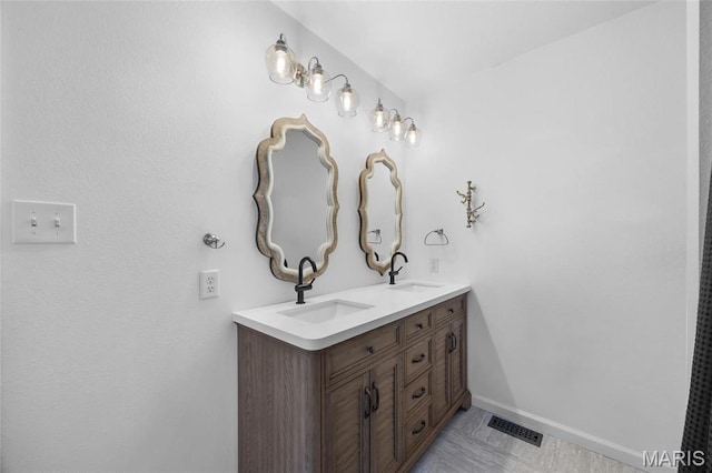 209 Hartland Ct, Hillsboro, MO 63050 - bathroom with double vanity and baseboards