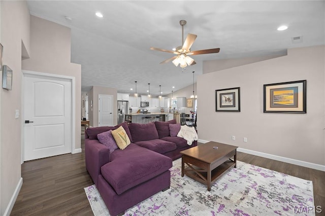 living area with ceiling fan, lofted ceiling, baseboards, dark wood-style floors, and recessed lighting