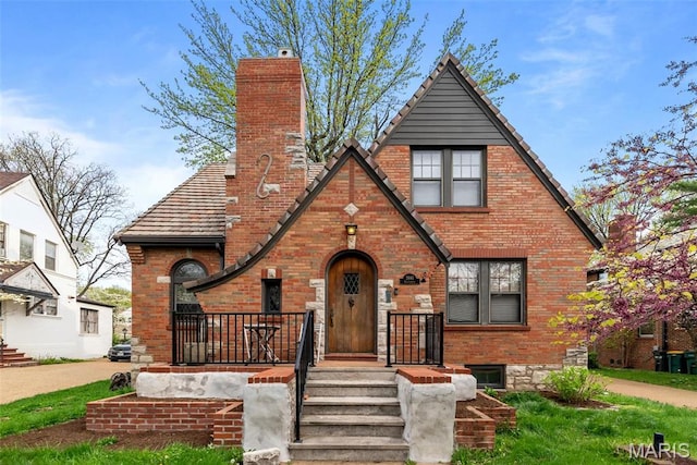 3981 Canterbury Dr, Saint Louis, MO 63121 - english style home featuring brick siding and a chimney