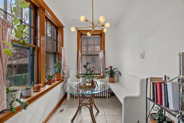 3981 Canterbury Dr, Saint Louis, MO 63121 - tiled dining area with a chandelier