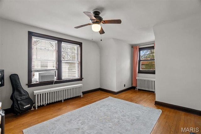 3981 Canterbury Dr, Saint Louis, MO 63121 - spare room with radiator heating unit, cooling unit, a ceiling fan, and wood finished floors