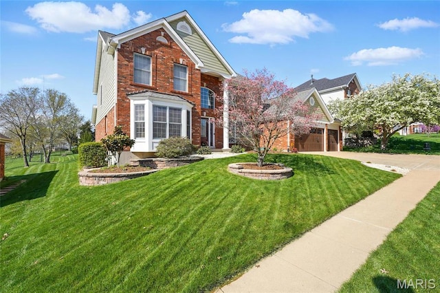 13456 Sunset Meadows Ln, Saint Louis, MO 63128 - view of front of home featuring brick siding, a front yard, and driveway