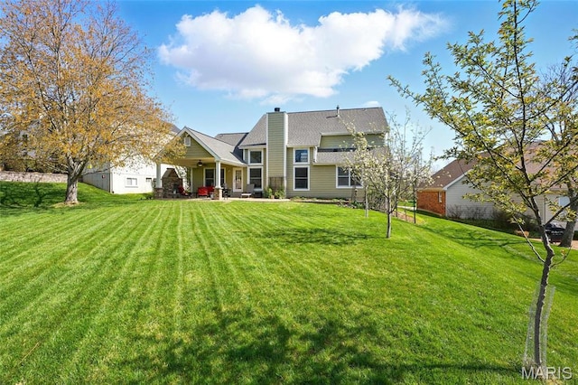 13456 Sunset Meadows Ln, Saint Louis, MO 63128 - back of property with a yard and a chimney
