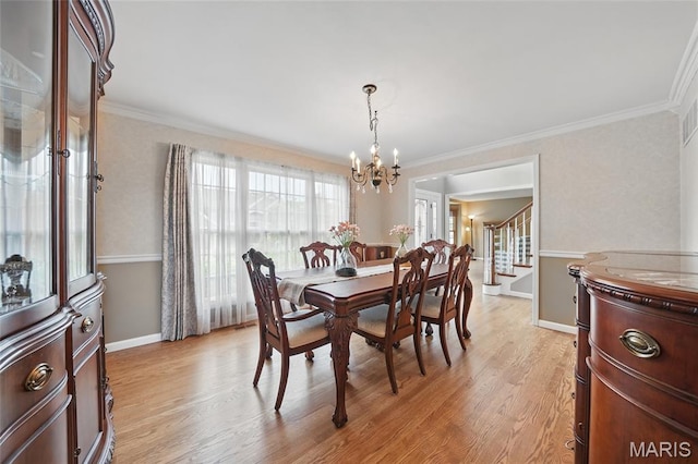 13456 Sunset Meadows Ln, Saint Louis, MO 63128 - dining space with a chandelier, crown molding, light wood-type flooring, stairway, and baseboards