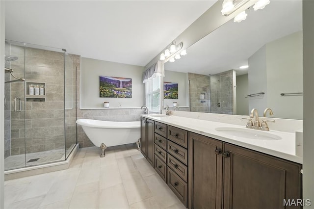 13456 Sunset Meadows Ln, Saint Louis, MO 63128 - bathroom with a stall shower, tile walls, a freestanding tub, double vanity, and tile patterned floors