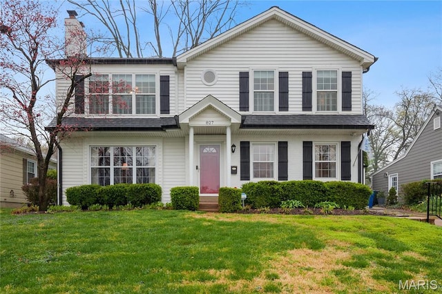 827 Yosemite Dr, Saint Louis, MO 63122 - view of front of house featuring a chimney and a front lawn