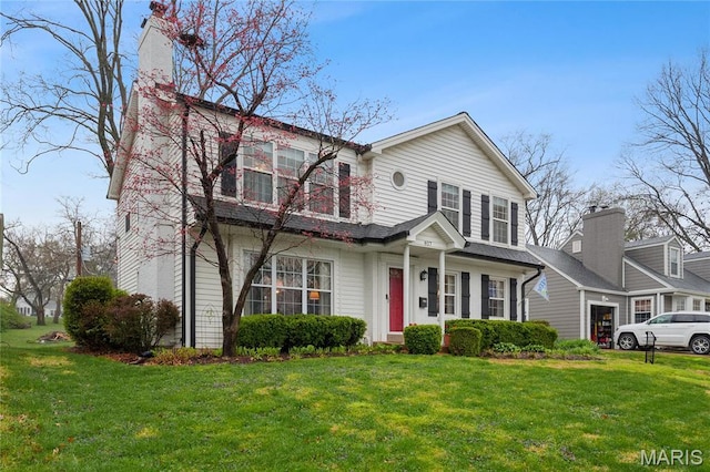 827 Yosemite Dr, Saint Louis, MO 63122 - traditional home featuring a front lawn and a chimney