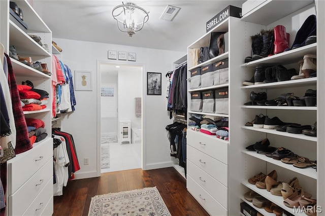 827 Yosemite Dr, Saint Louis, MO 63122 - spacious closet with dark wood finished floors