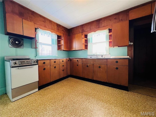 604 Salling St, Perry, MO 63462 - kitchen featuring open shelves, electric range oven, and brown cabinets