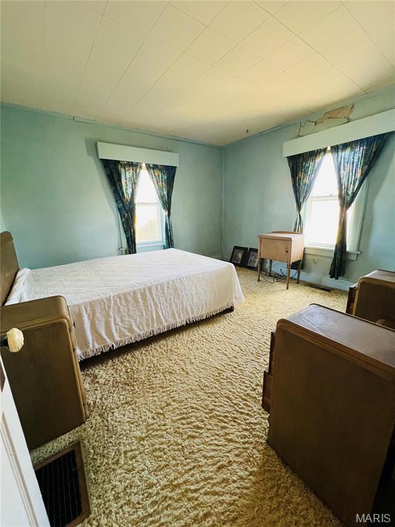 604 Salling St, Perry, MO 63462 - carpeted bedroom with multiple windows