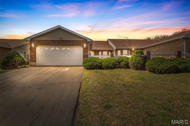1654 Napoleon Dr, Bonne Terre, MO 63628 - single story home featuring brick siding, driveway, a garage, and a front lawn