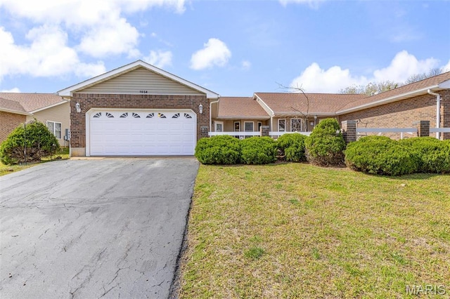 1654 Napoleon Dr, Bonne Terre, MO 63628 - ranch-style house with brick siding, asphalt driveway, an attached garage, and a front yard